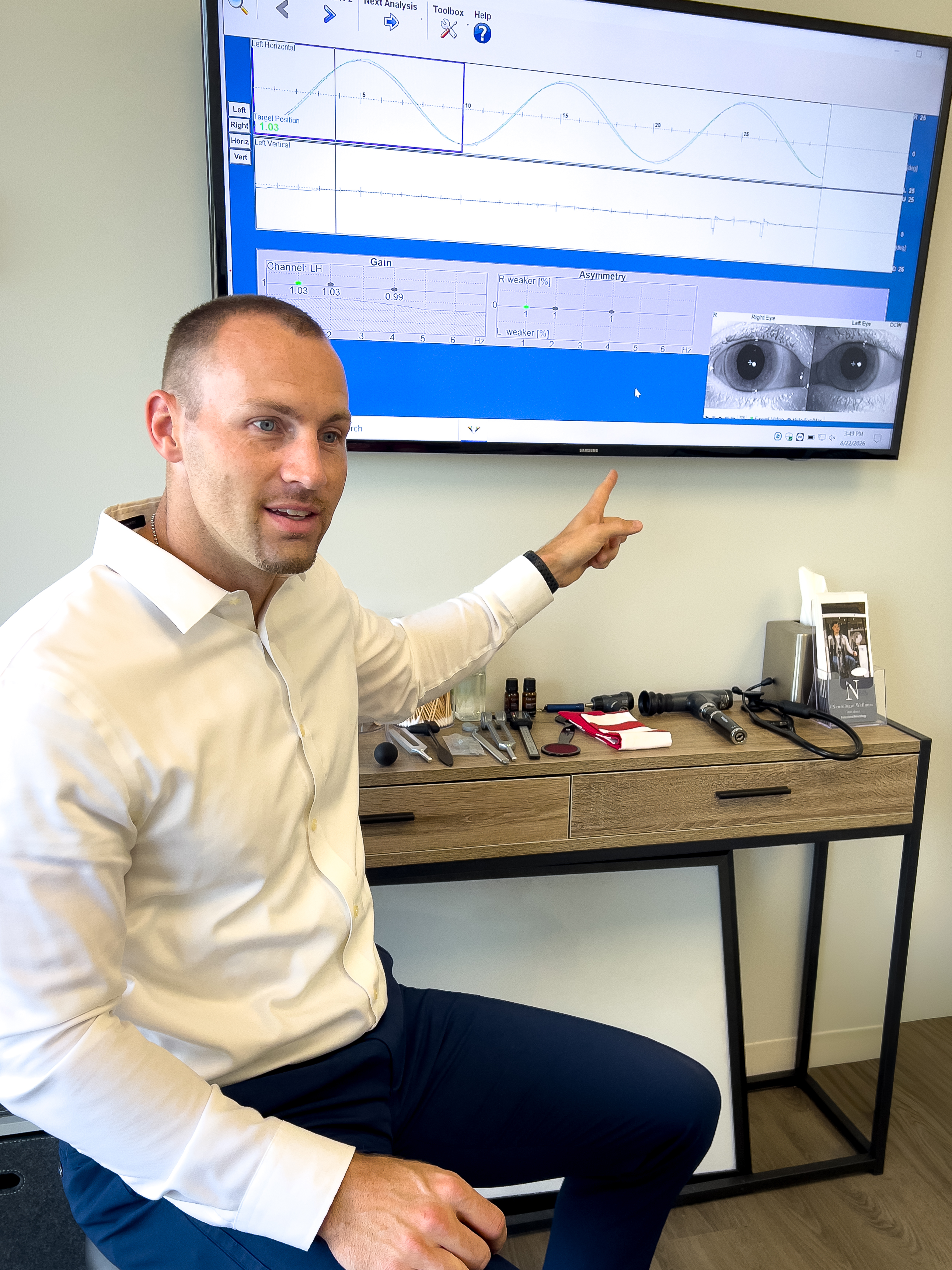 Dr. Nick holding a football in the clinic