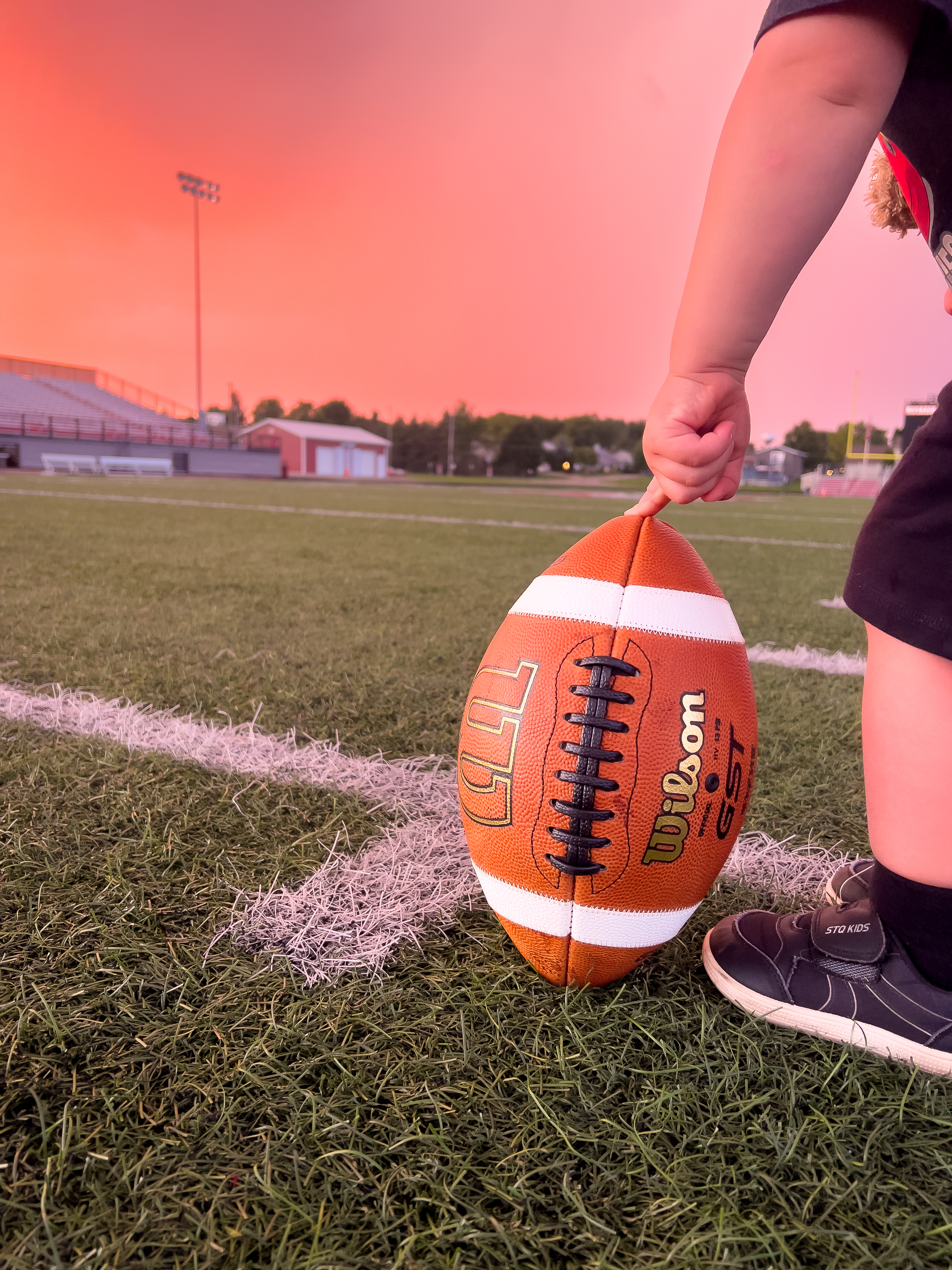 Dr. Nick with a football at the clinic